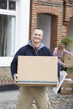 Person organizing belongings in Eastbedfont storage space
